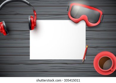 Creative ski workplace with white paper and dark wood background. Winter ski theme. Top view flat lay.