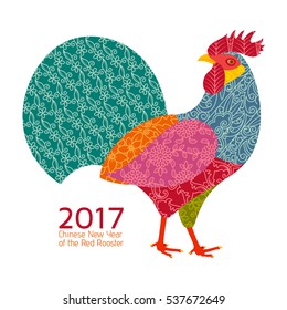 Creative stylized rooster in patchwork style. 2017 New Year symbol red cock. Vector illustration