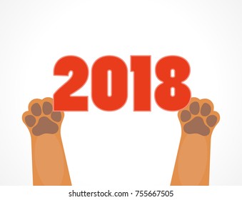 Creative text 2018 with paws of a dog.