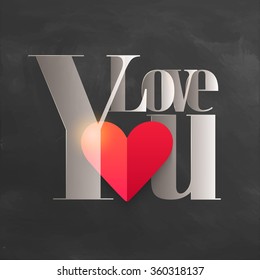 Creative text Love You with glossy heart on chalkboard background for Happy Valentine's Day celebration.