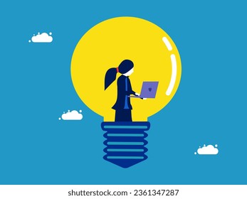 Creative thinking. Businesswoman working on laptop in light bulb 