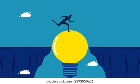 Creative thinking, overcoming obstacles. Businessman running across a light bulb bridge over a cliff