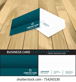 Creative vector business card template design with front and back side. Wooden background with perspective view.