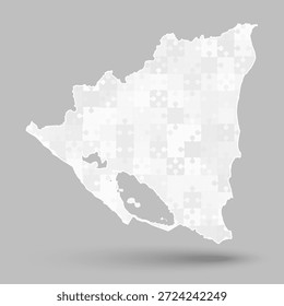 Mapa vetorial criativo da Nicarágua a partir de peças de quebra-cabeça cinzentas isoladas no fundo. País americano modelo para padrão, design, ilustração, infográfico. Descrição do mapa jigsaw Nicaragua