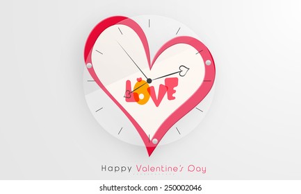 Creative wall clock with heart and text Love for Happy Valentine's Day celebration.