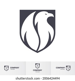 Creative White Eagle Logo Inside Shield. Concept Inspiration Template Ready for Use. Modern Professional Hawk Logo Design. Phoenix Head Logo Illustration