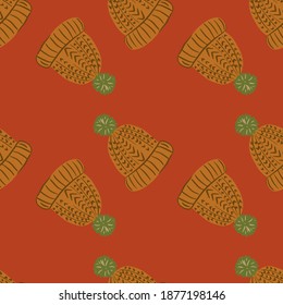 Creative winter seamless pattern with hygge knitted hat orange ornament. Pale red background. Graphic design for wrapping paper and fabric textures. Vector Illustration.