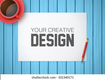 Creative workplace with white paper and blue background. Top view flat lay.