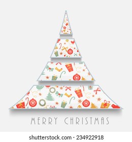 Creative X-mas Tree decorated with colorful ornaments on grey background for Merry Christmas celebrations.