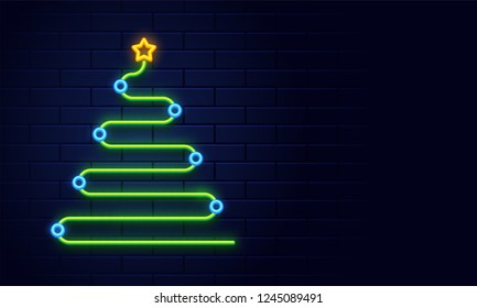 Creative xmas tree made by neon lighting effect on blue brick wall background for merry christmas celebration.