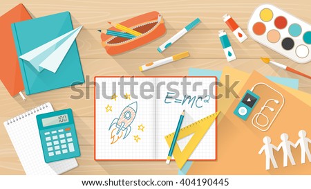 Creative young student desktop with notebook, books and colors, education, learning and childhood concept