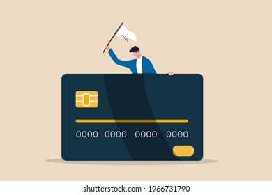 Credit card debt compromise, accept failure and negotiate with debtor concept, struggle bankruptcy man surrender carry and waving the white flag behind big credit card debt.