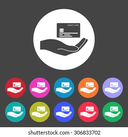 Credit card in hand icon. Set of colored icons.