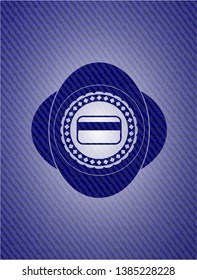 credit card icon inside emblem with denim texture