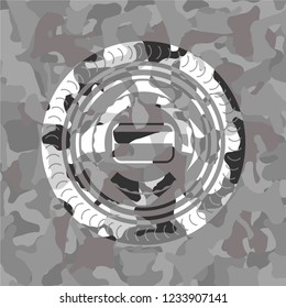 credit card icon inside grey camouflaged emblem
