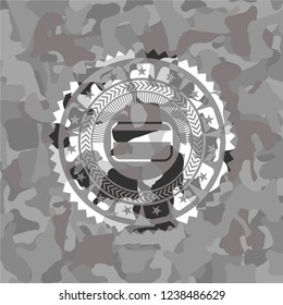 credit card icon inside grey camouflage texture