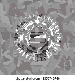 credit card icon inside grey camouflage emblem