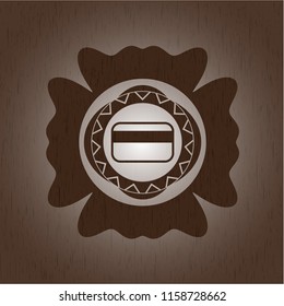 credit card icon inside retro style wooden emblem