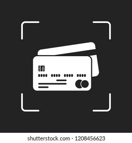 credit card icon. White object in camera autofocus on dark background