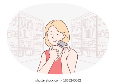 Credit card, paying, shopping, online banking, purchase, buying, customer concept. Young smiling woman cartoon character holding credit card in hands and showing thumbs up during shopping alone