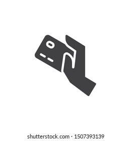 Credit card payment vector icon. filled flat sign for mobile concept and web design. Hand with credit card glyph icon. Payment option symbol, logo illustration. Vector graphics