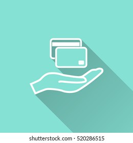 Credit card vector icon with long shadow. White illustration isolated on green background for graphic and web design.