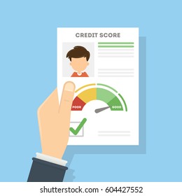 Credit score document. Man holds the aper with foto and personal information about credit and index.