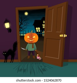 A creepy little kid in scary pumpkin head stands in front of the door at halloween night to trick or treat for candy.