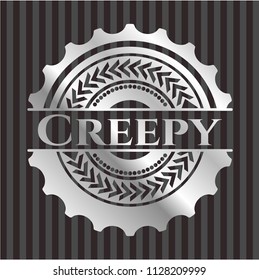 Creepy silver emblem