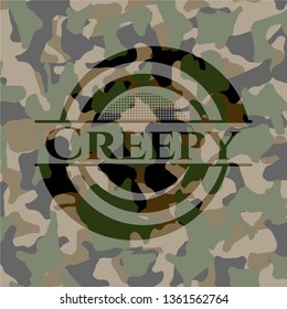 Creepy written on a camouflage texture