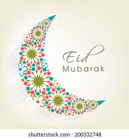 Crescent moon decorated with colourful flowers on beige background for muslim community festival Eid Mubarak celebrations. 