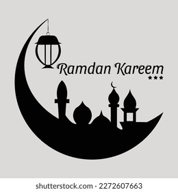 a crescent moon with a mosque and an ornate silhouette of a lantern