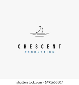 a crescent moon on the top of calm sea