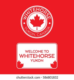 A crest and a welcome sign for Whitehorse Yukon, Canada that features maple leaves.