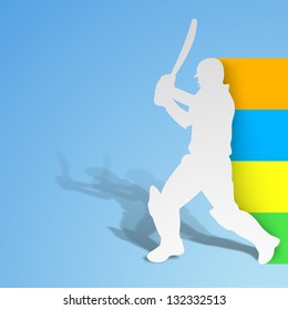 Cricket batsman in playing action on blue background.