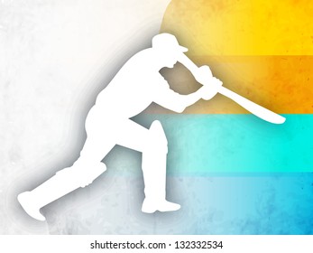 Cricket batsman in playing action on colorful abstract background.