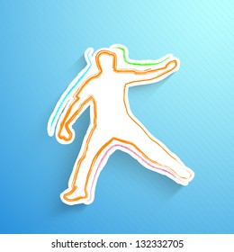 Cricket bowler in playing action on blue background.