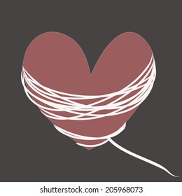 Crimson heart with white rope on a gray background