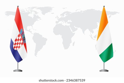 Croatia and Ivory Coast flags for official meeting against background of world map.