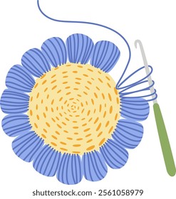 Crochet hook with blue yarn wrapped around is creating a crocheted flower with blue petals and a yellow center, demonstrating a crafting process