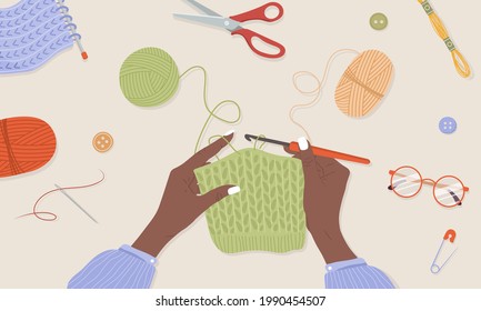 Crochet knitting process. African female hands with hook and thread. Balls of yarn. Top view of the workplace. Tailor shop elements. Hand drawn vector illustration in flat cartoon style.