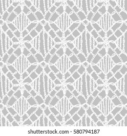 Crochet pattern. Knitting texture. Granny handmade lace. Macrame. Hygge lifestyle. Woman fashion. Boho style seamless background. Vector illustration for fashion or interior fabric design.