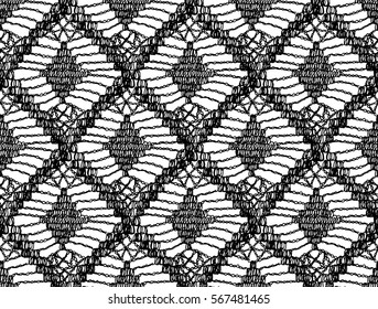 Crochet seamless pattern. Knitted or woven macrame in the bohemian style. Oriental motifs. Knitting mesh