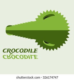 Crocodile head silhouette reflected in water. Alligator face icon can be used for logos, T-shirts print, labels, badges and stickers. Vector illustration.