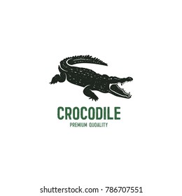 crocodile logo template. Symbol of alligator, Crocodile with text. Wild animal typography badge design. Vintage hand drawn insignia. Stock vector illustration isolated on white background.