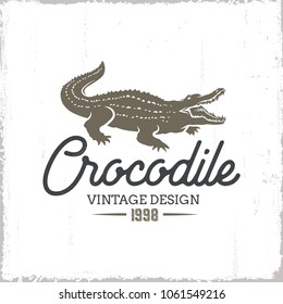 Crocodile vintage logo isolated on grunge background.Vector illustration.