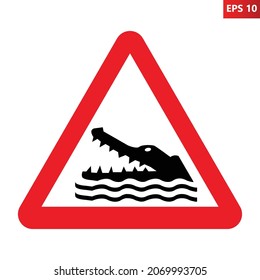 Crocodiles, alligators, caimans warning sign. Vector illustration of red triangle sign with reptile head with open jaws. Caution wild dangerous animals. Risk of attack. Danger zone.