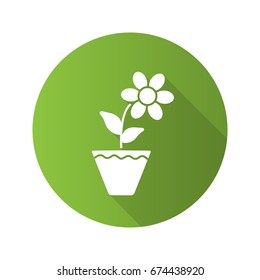 Crocus in flowerpot flat design long shadow glyph icon. Vector silhouette illustration
