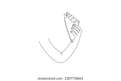 Croissant continuous one line drawing. Hand holding fresh baked pastry. Breakfast theme for logo posters. Vector illustration