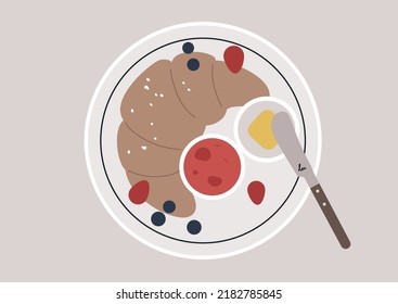A croissant with fresh berries, butter and berry jam served on a plate, top view